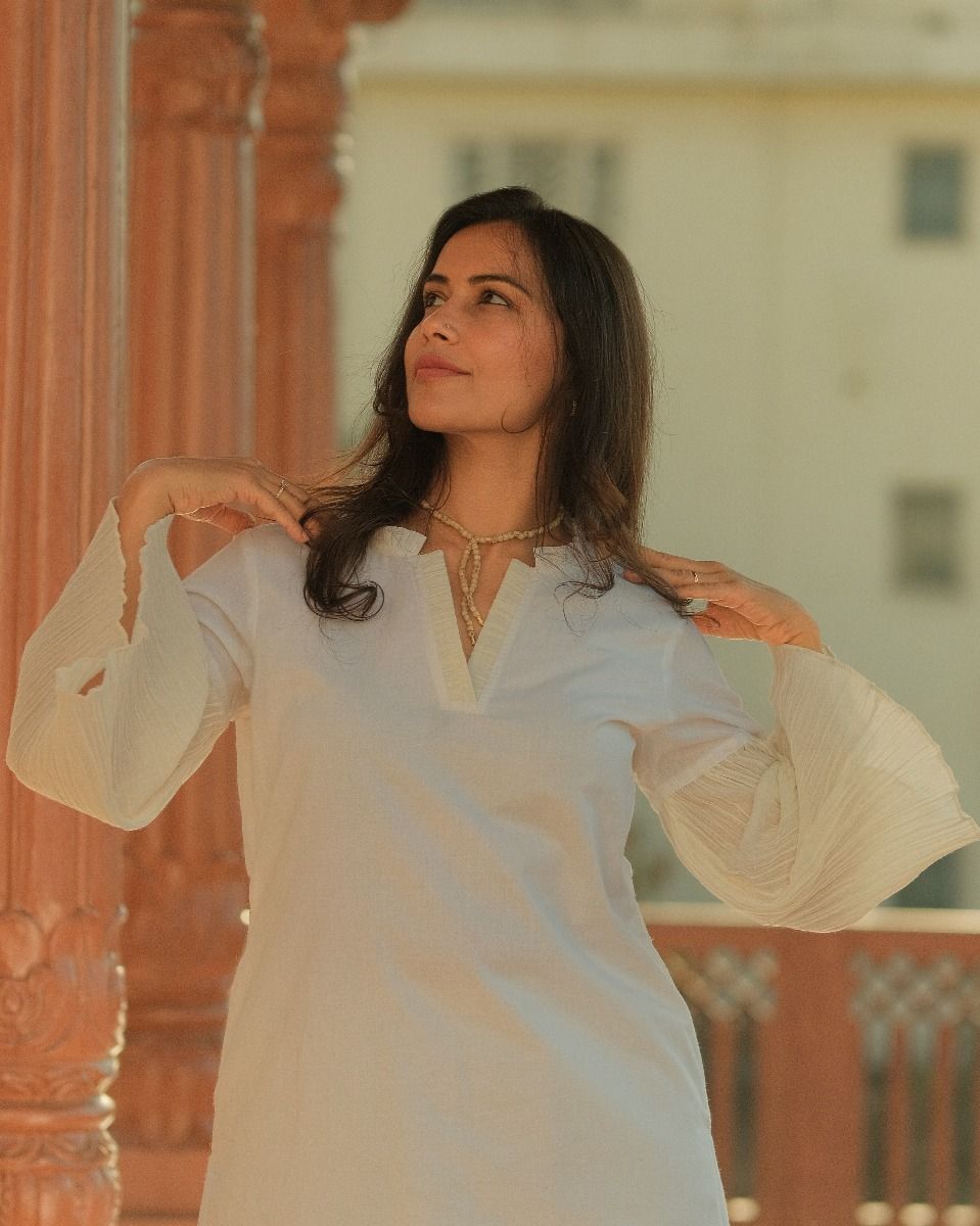 White Sophisticated Kurta Pants with crush detailings, Gracefully falling on the hands. .