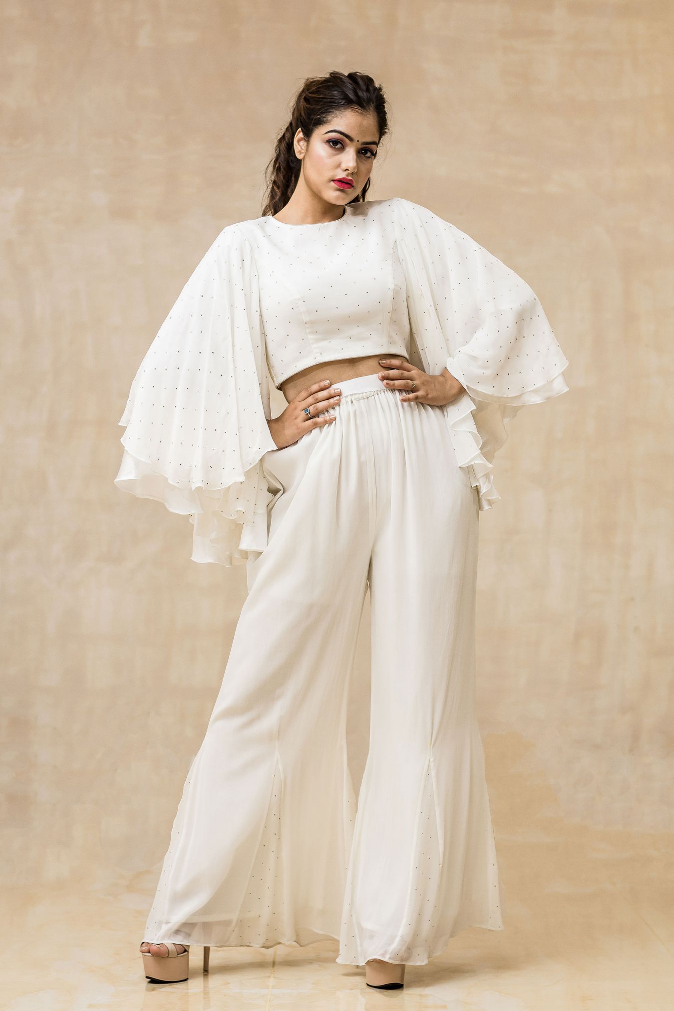 Flamboyant Circular Sleeved Georgette Top with Inticrate Mukaish work in Radiant White.