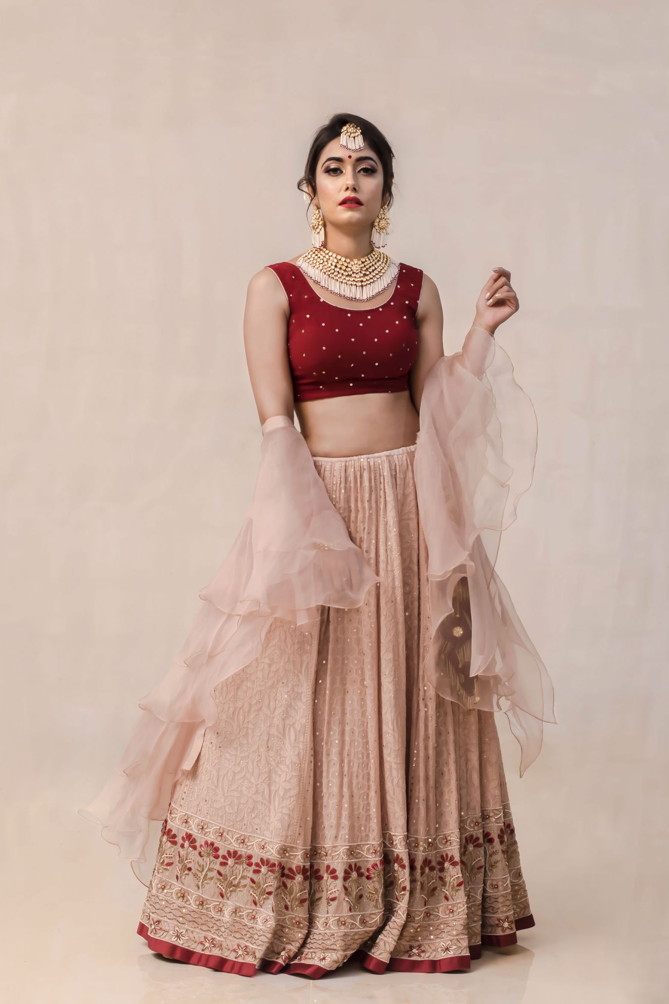 A Romantic Union of Maroon and Earthly Hazelnut Tone Creating a Unique Ensemble of Handcrafted Chikankari Lehenga.