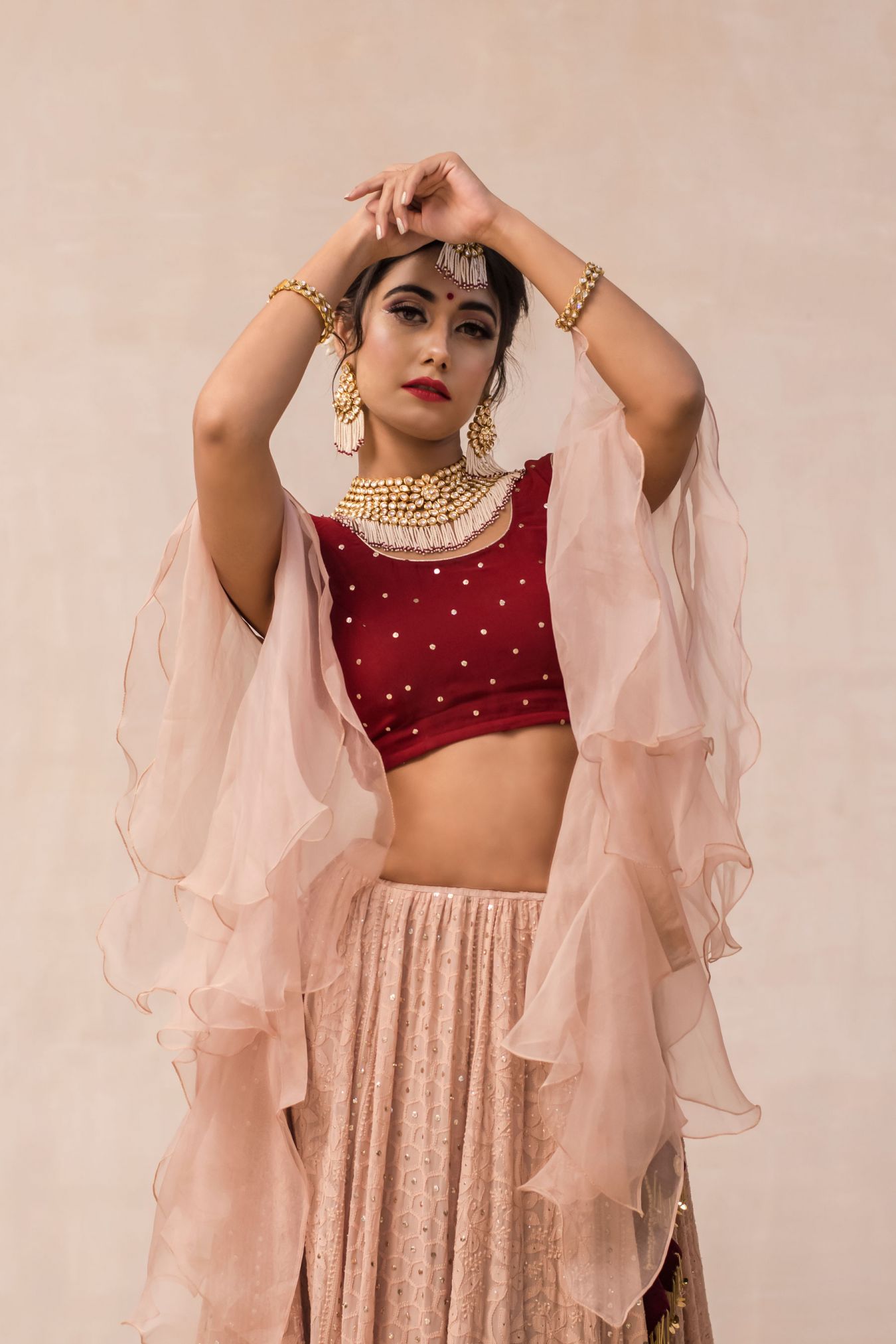 A Romantic Union of Maroon and Earthly Hazelnut Tone Creating a Unique Ensemble of Handcrafted Chikankari Lehenga.