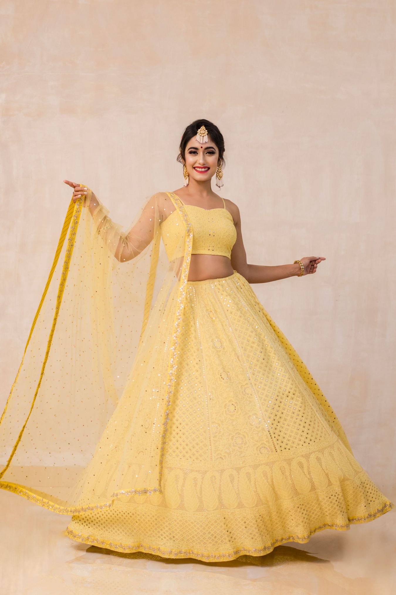 Dreamy and Handcrafted Chikan Mukaish Lehenga Embellished With Zardozi & Gota Patti Work Glimmering in Spectacularly Jazzy Yellow color