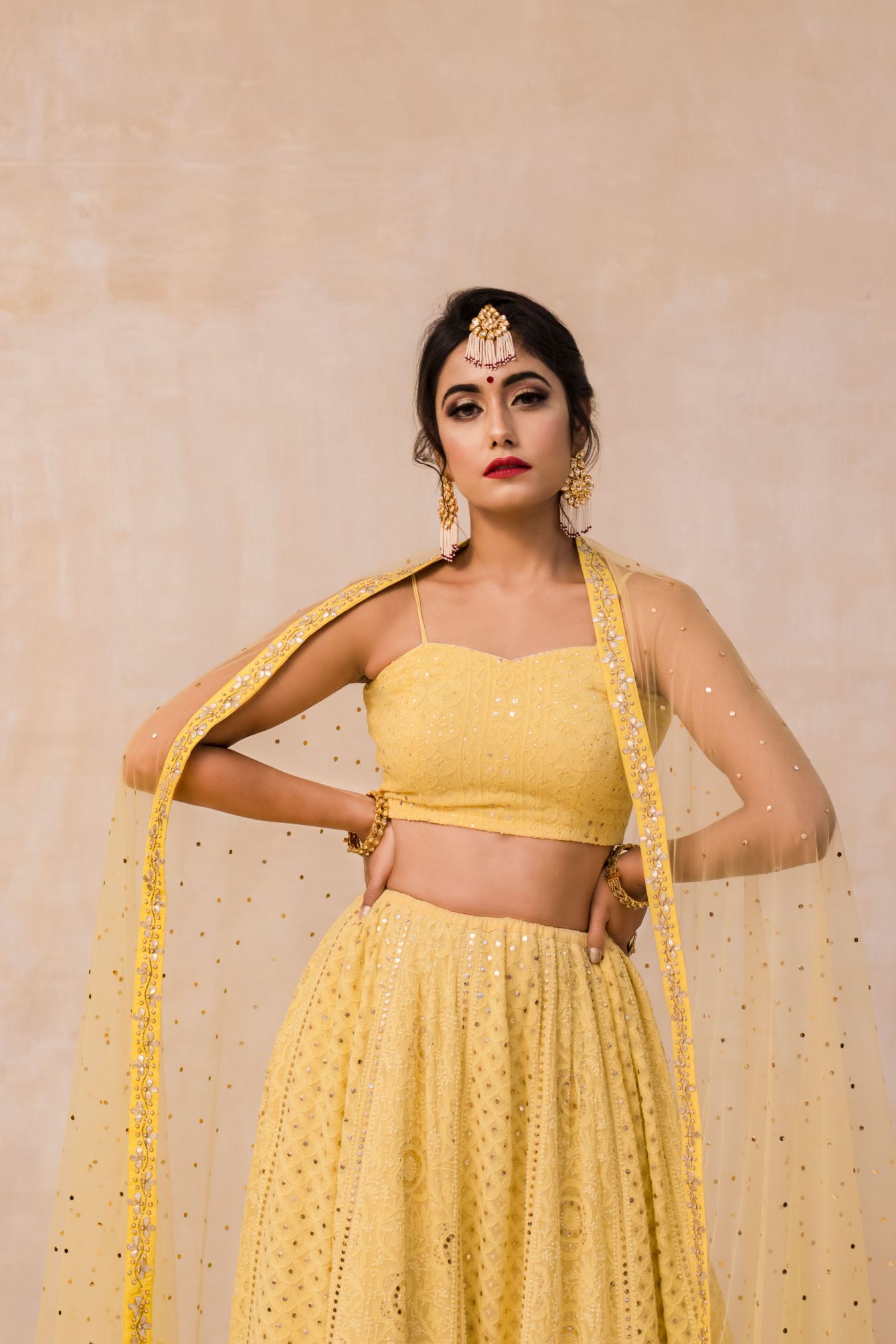 Dreamy and Handcrafted Chikan Mukaish Lehenga Embellished With Zardozi & Gota Patti Work Glimmering in Spectacularly Jazzy Yellow color