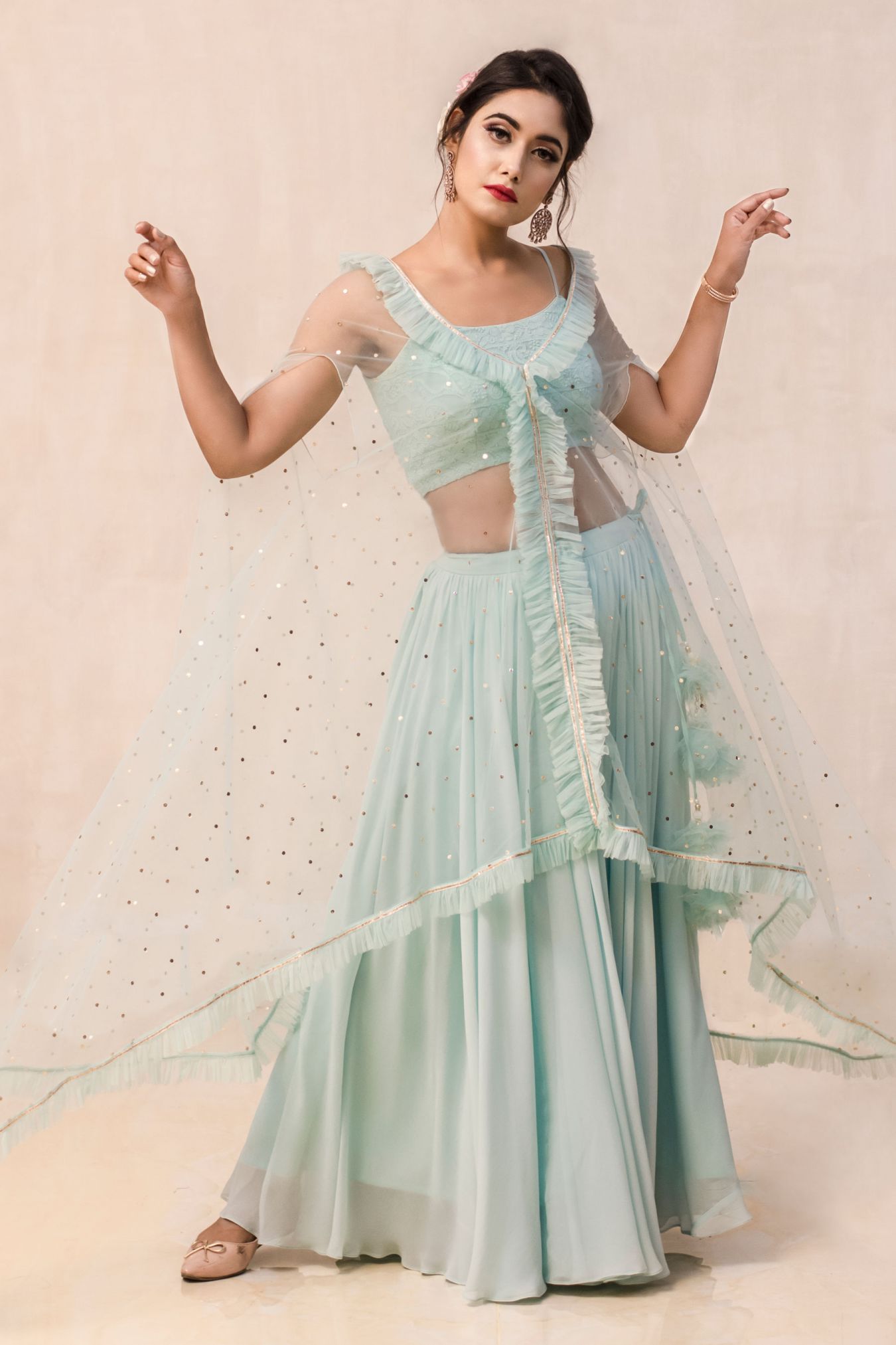 Beaming Ocean Blue Contemporary Georgette Skirt with Net Cape & Chikan Crop Top Bound to Create an Aura of Grace and Elegance.