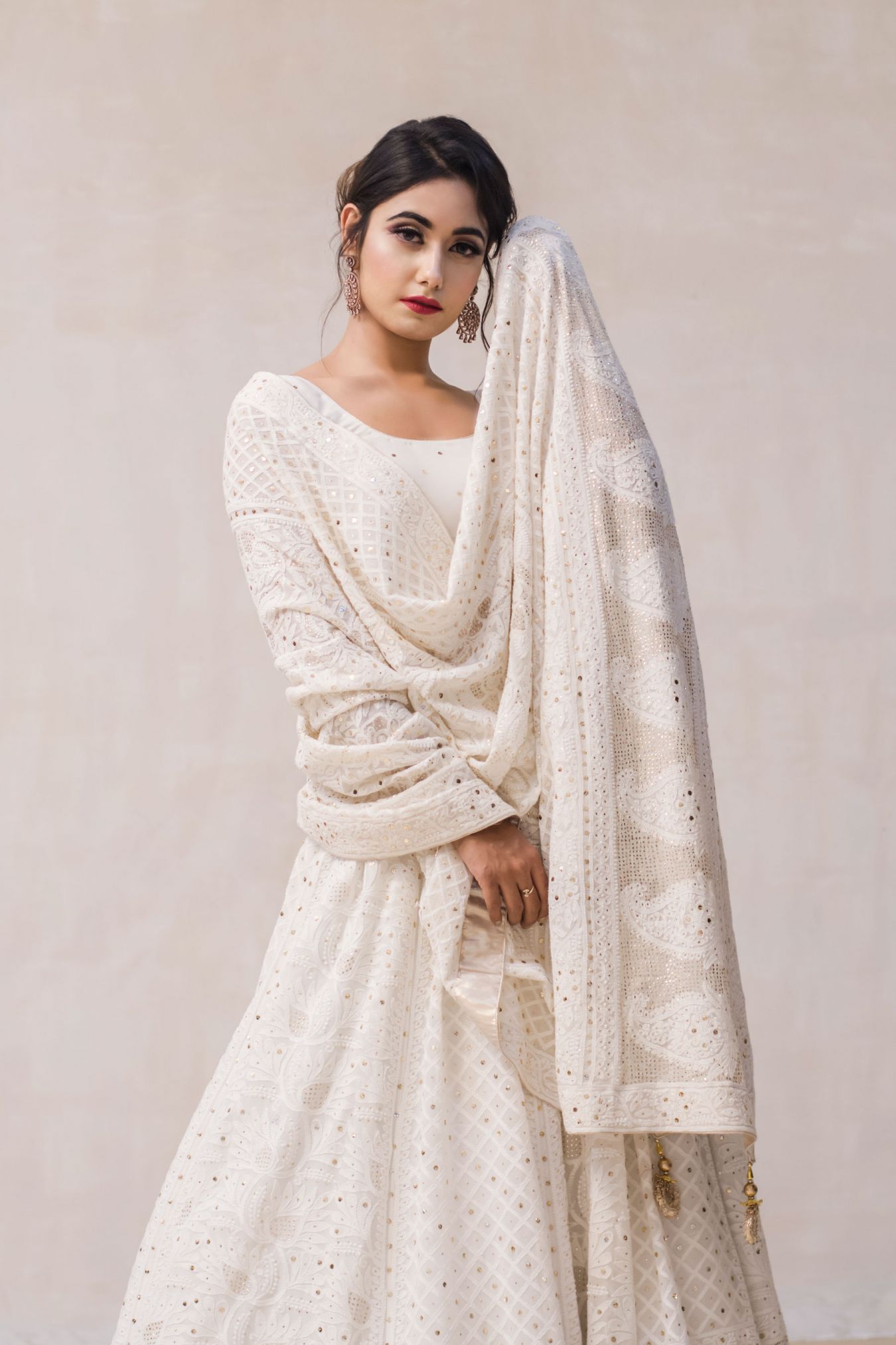 A Perfect Family Heirloom Piece of Traditionally Handcrafted Chikankari Lehenga in Classic Ivory.